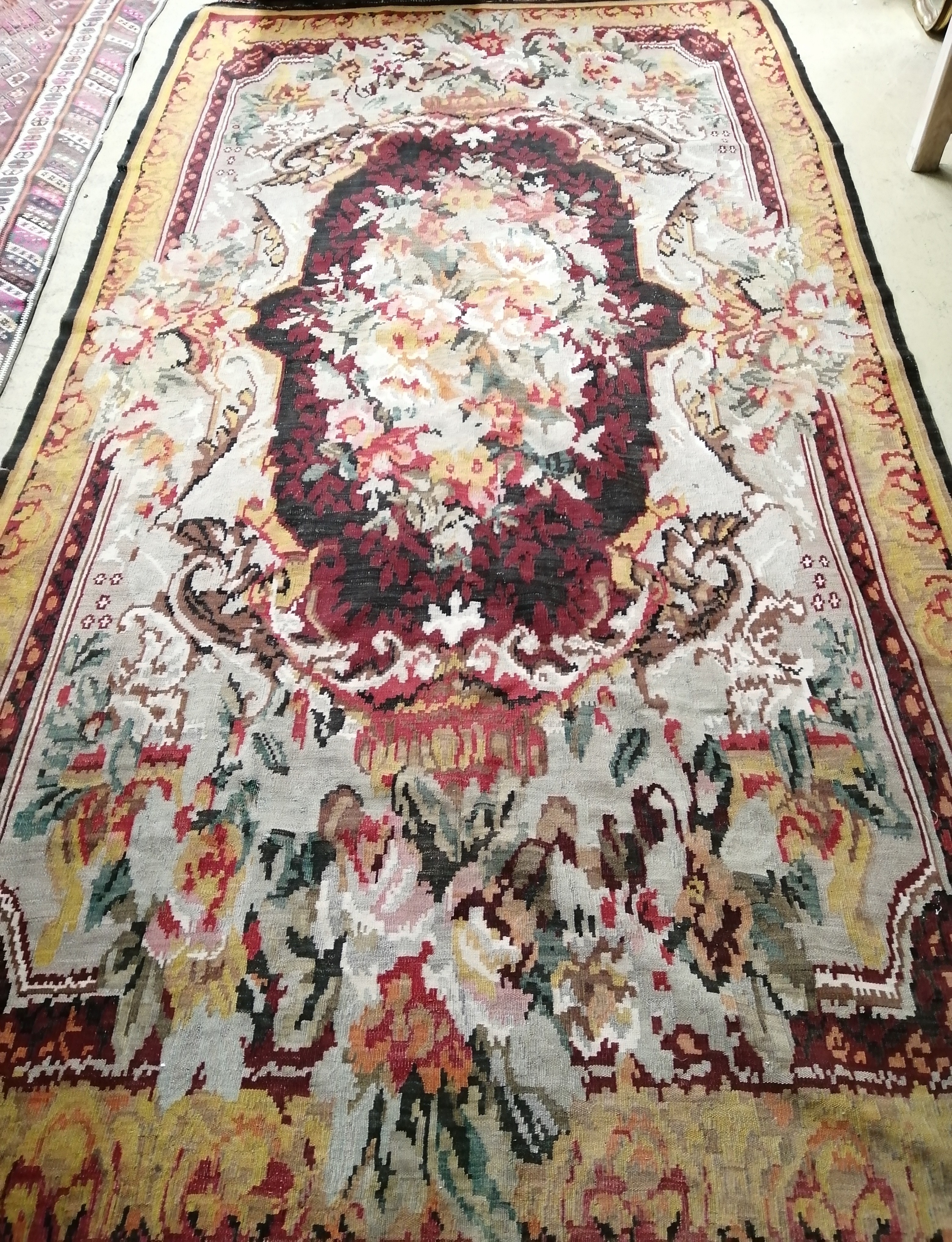 A Kilim floral polychrome carpet, approx. 340 x 200cm
